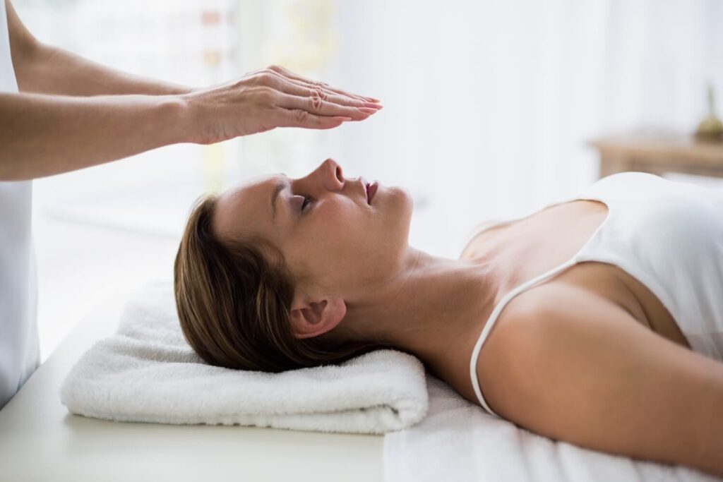 Young woman in a Reiki session